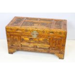 20th Century Chinese carved trunk having panelled detailing with hinged lid raised on bracket
