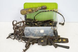 Large collection of assorted horse brasses and leather horse tack. 1 box.