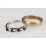 A hallmarked 9ct gold wedding band ring together with a hallmarked 18ct white gold diamond and