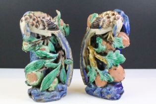 Pair of Chinese antique polychrome pottery spill vases, modelled as birds atop branches with