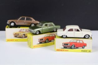 Three boxed French Dinky diecast models to include 1428 Peugeot 304 Saloon in metallic green with