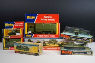 Seven boxed Dinky military diecast models to include 602 Armoured Command Car, 618 AEC Artic