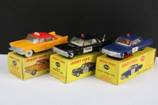 Three boxed Dinky diecast models to include 258 USA Police Car, 264 RCMP Patrol Car (with loose