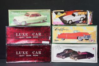 Six boxed tin plate friction powered model cars to include MF322 Standard Sedan Voiture in white