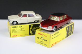 Two boxed French Dinky diecast models to include 530 DS23 in dark red metallic body with matt