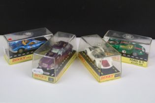 Four cased Dinky diecast models to include 216 Ferrari Dino in metallic blue, black engine cover tan