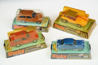 Four boxed Dinky diecast models to include 168 Ford Escort, 227 Beach Buggy (discolouring to box