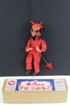 Boxed Pelham Puppet SM The Devil in red dress with arrow, contained within early