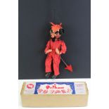 Boxed Pelham Puppet SM The Devil in red dress with arrow, contained within early