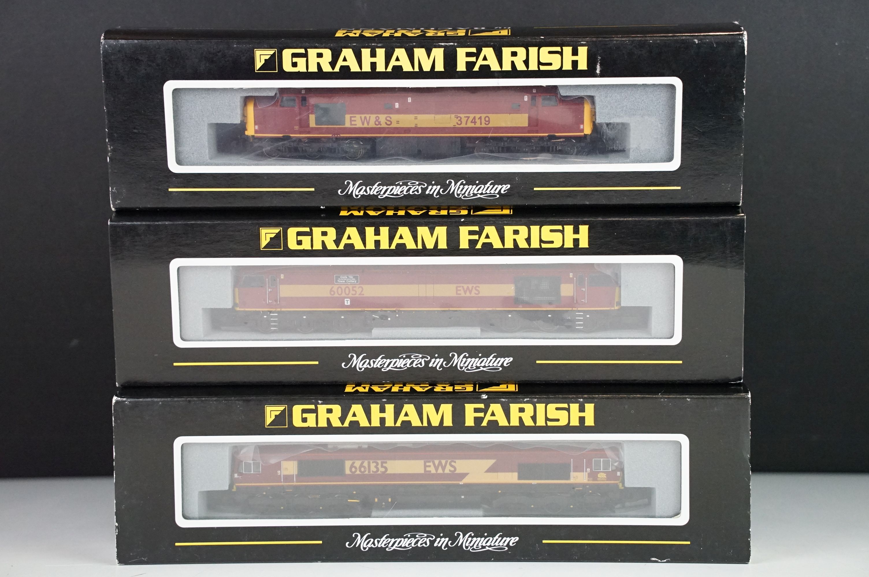 Three cased Graham Farish by Bachmann N gauge locomotives to include 371153 Class 37/4 37419 EWS,