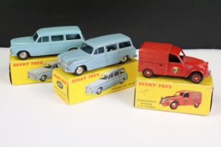 Three boxed French Dinky diecast models to include 2 x 24F Familiale 403 Peugeot in greyish blue,