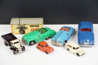 Six clockwork plastic and tin plate models to include 5 x Triang Minic examples featuring flatbed