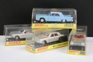 Four cased Dinky diecast models to include 2 x 164 Mk 4 Ford Zodiac in metallic grey with red