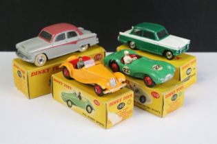 Four boxed Dinky diecast models to include 102 MG Midget Sports Car in yellow with red interior, red