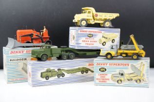 Four boxed Dinky Supertoys diecast models to include French 885 Bulldozer (broken treads, a few