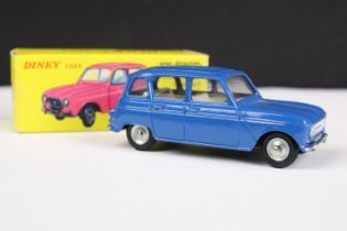 Boxed French Dinky 518 Renault 4L diecast model in dark blue with creamy white interior, silver