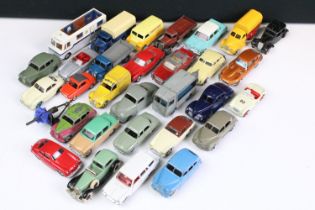 Around 30 Mid 20th C play worn Dinky diecast models to include French Citroen 2CV, 30V Electric Van,