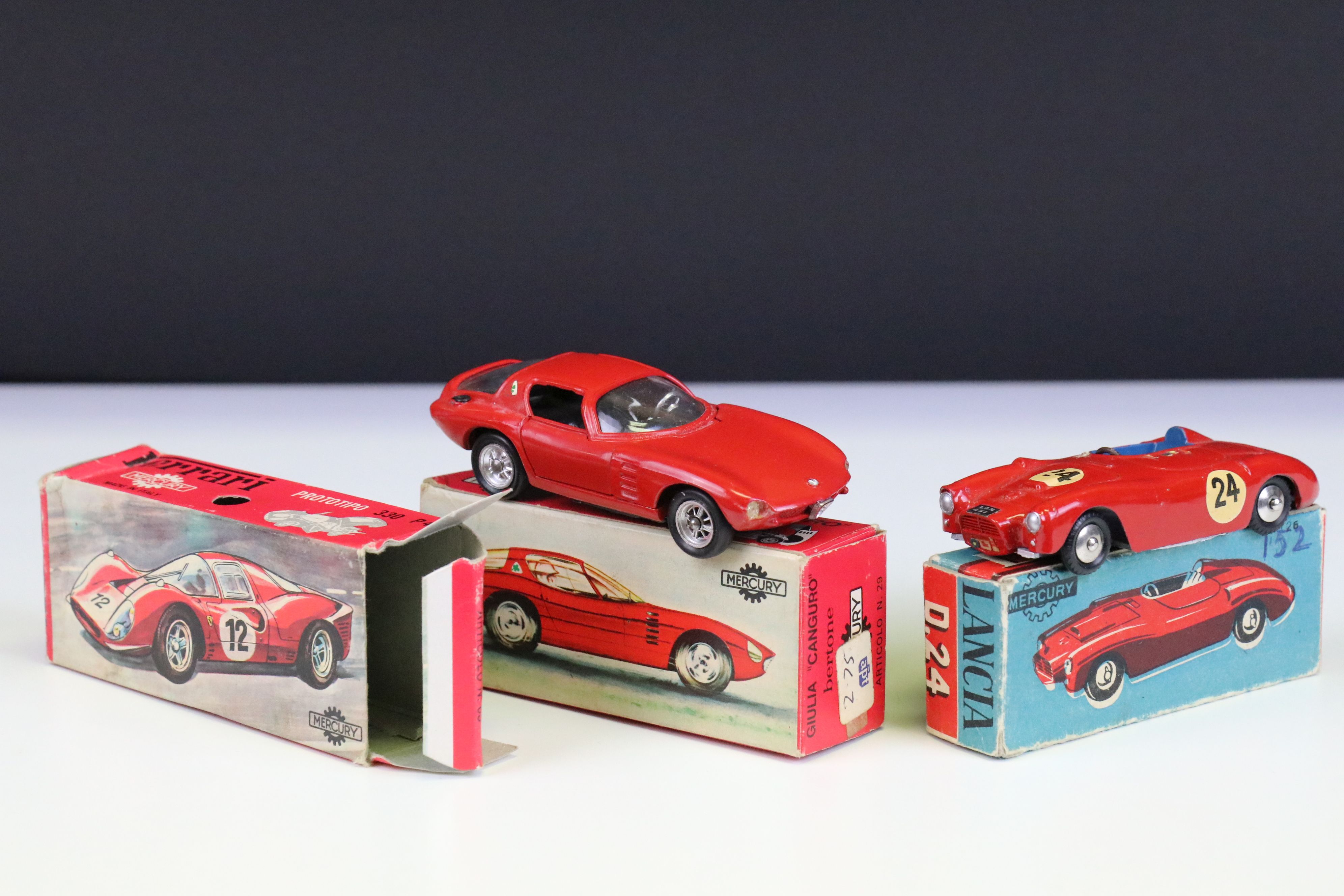Two boxed Mercury diecast models to include Lancia D24 in red (diecast vg with a couple of decals