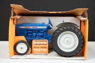 Boxed ERTL Ford 4000 Tractor diecast model in blue, complete with exhaust stack still sealed in