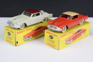 Two boxed French Dinky 24Y Studebaker Commander diecast models, one in dark orange / coral with