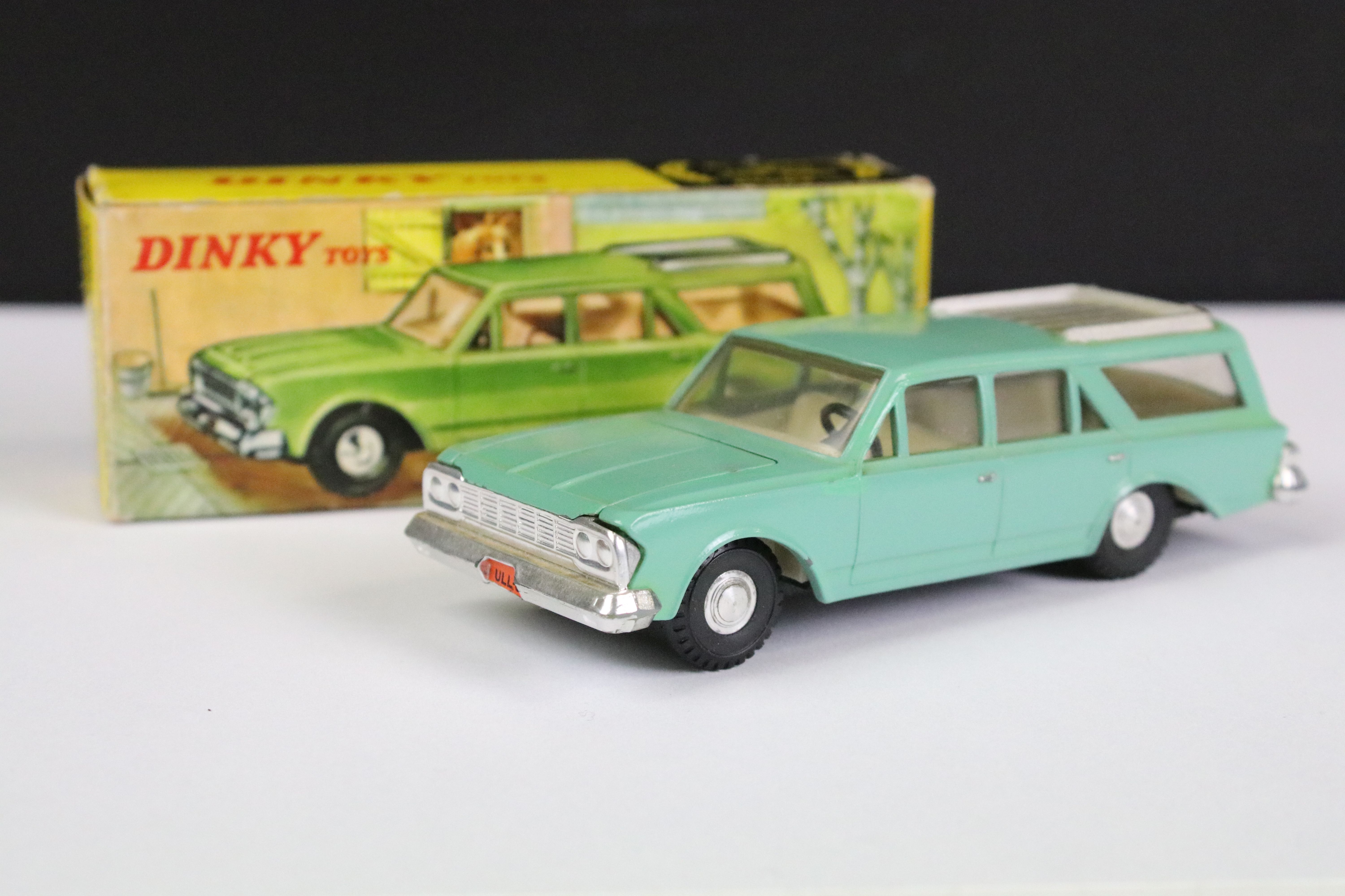 Boxed Hong Kong Dinky 57/006 Rambler Classic diecast model in pale green with silver roof and