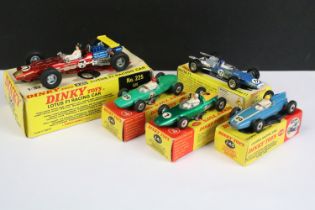 Five boxed Dinky diecast racing cars to include 225 Lotus F1 in red, with driver and inner display