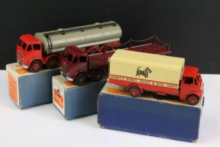 Three boxed Dinky diecast models to include 505 Foden Flat Truck with chains in maroon and maroon