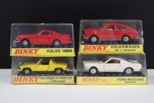 Four cased Dinky diecast models to include 163 Volkswagen 1600TL Fastback in red with white interior