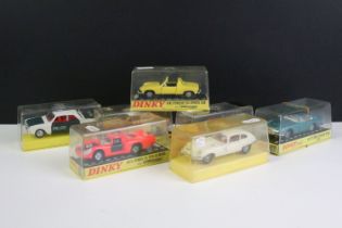 Seven cased Dinky diecast models to include 210 Alfa Romeo 33 Tipo Le Mans with Speedwheels, 153