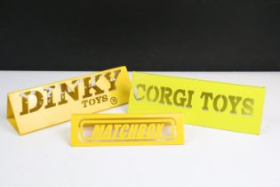 Three yellow painted metal shop display advertising signs to include Corgi Toys, Dinky Toys and