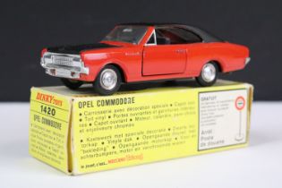 Boxed French Dinky 1420 Opel Commodore diecast model with red body, black bonnet and black vinyl