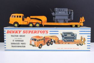 Boxed French Dinky Supertoys 898 Tracteur Berliet diecast model in orange body with yellow hubs,
