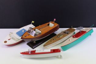 Four unboxed clockwork and battery operated model boats to include Sutcliffe Model Merlin in white