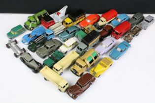 30 Mid 20th C Dinky diecast models to include 39F Studebaker State Commander Coupe in grey, French