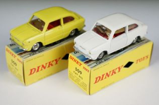 Two boxed French Dinky 509 Fiat 850 diecast models, one in white with red interior, concave hubs and