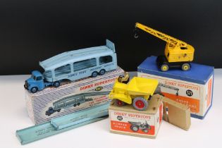 Three boxed Dinky Supertoys diecast models to include 562 Dumper Truck in yellow with red hubs,