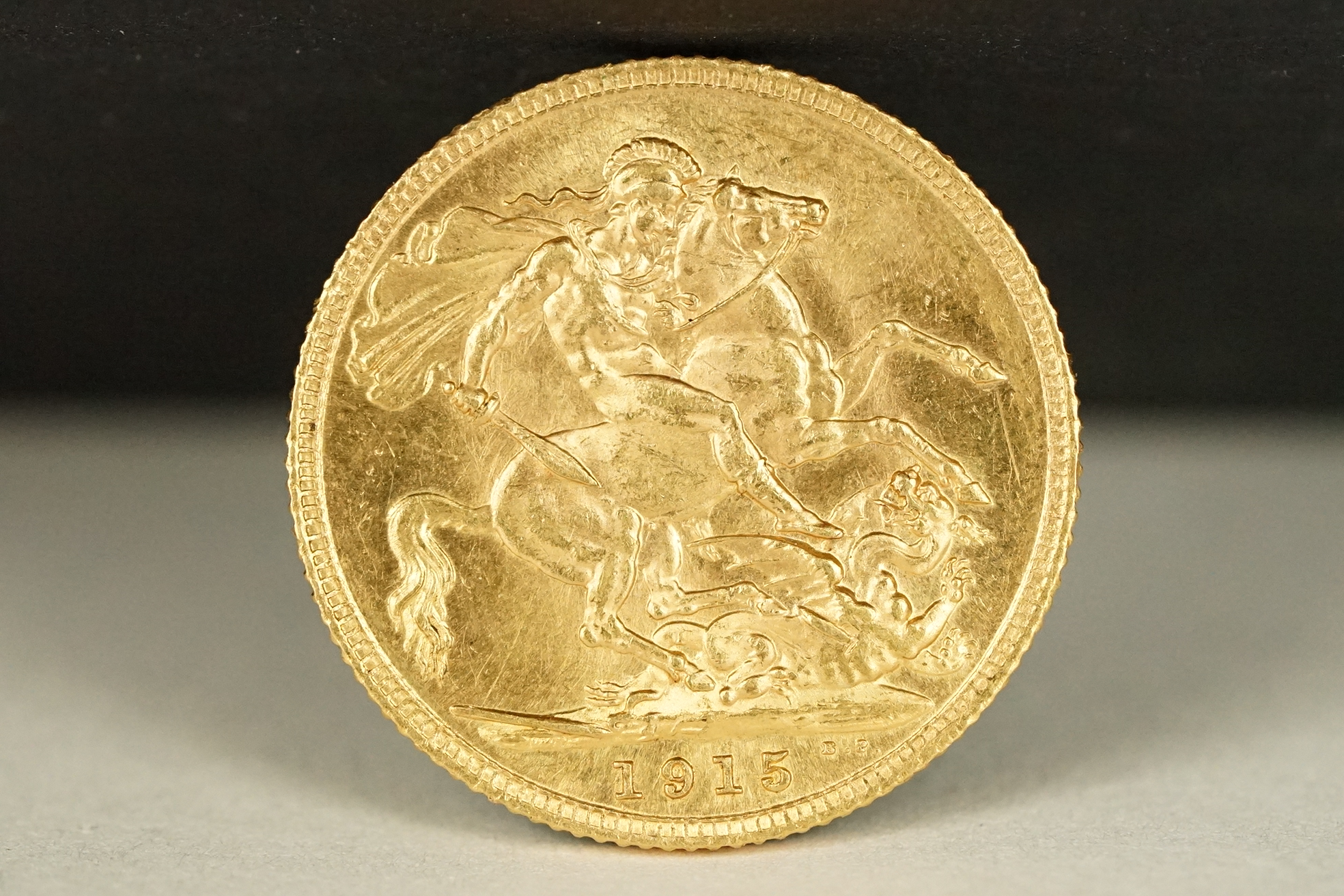 A British King George V 1915 gold full sovereign coin.