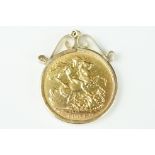A British King Edward VII 1903 gold full sovereign coin mounted within a 9ct gold mount.