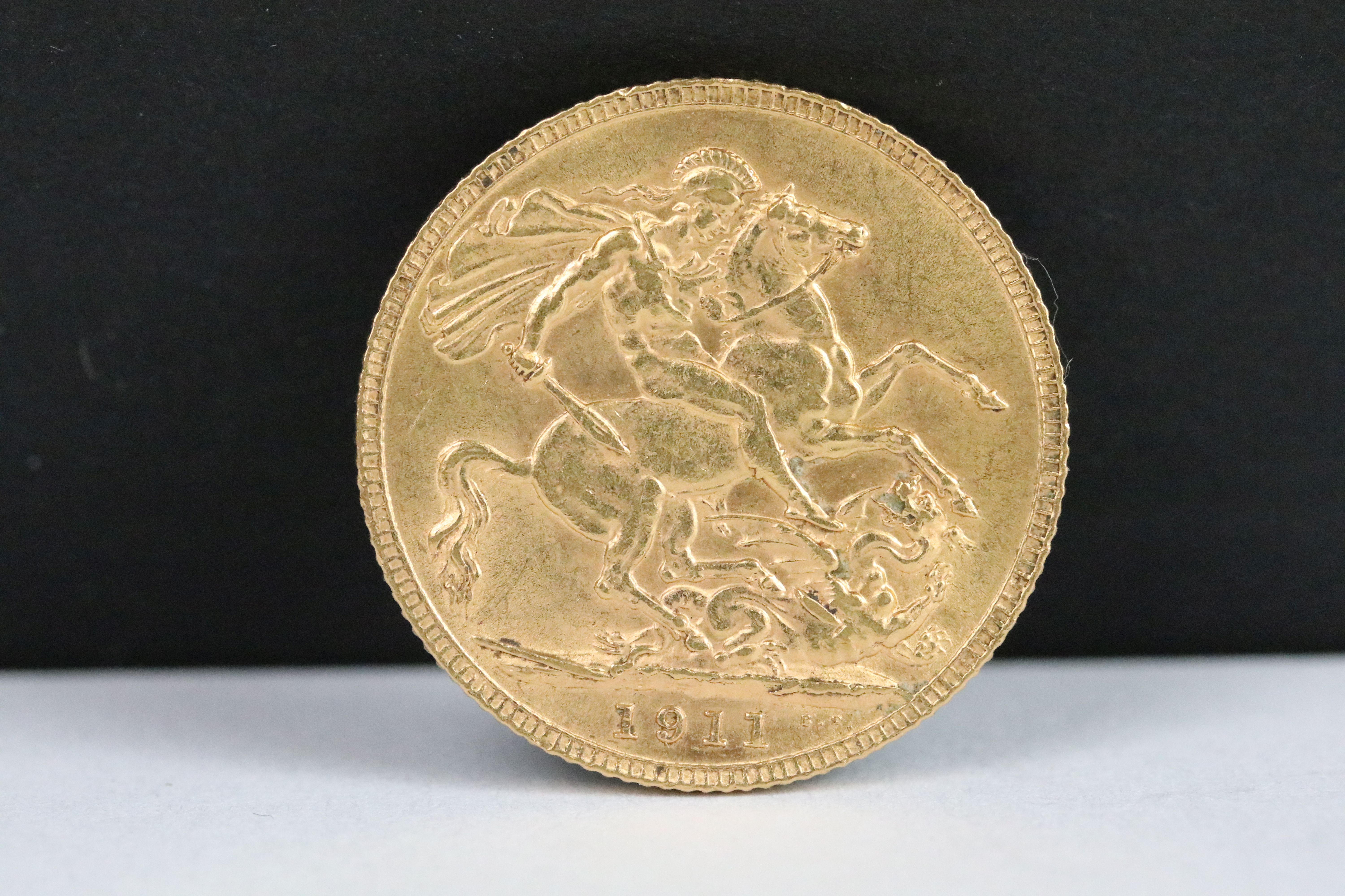 A British King George V 1911 gold full sovereign coin.