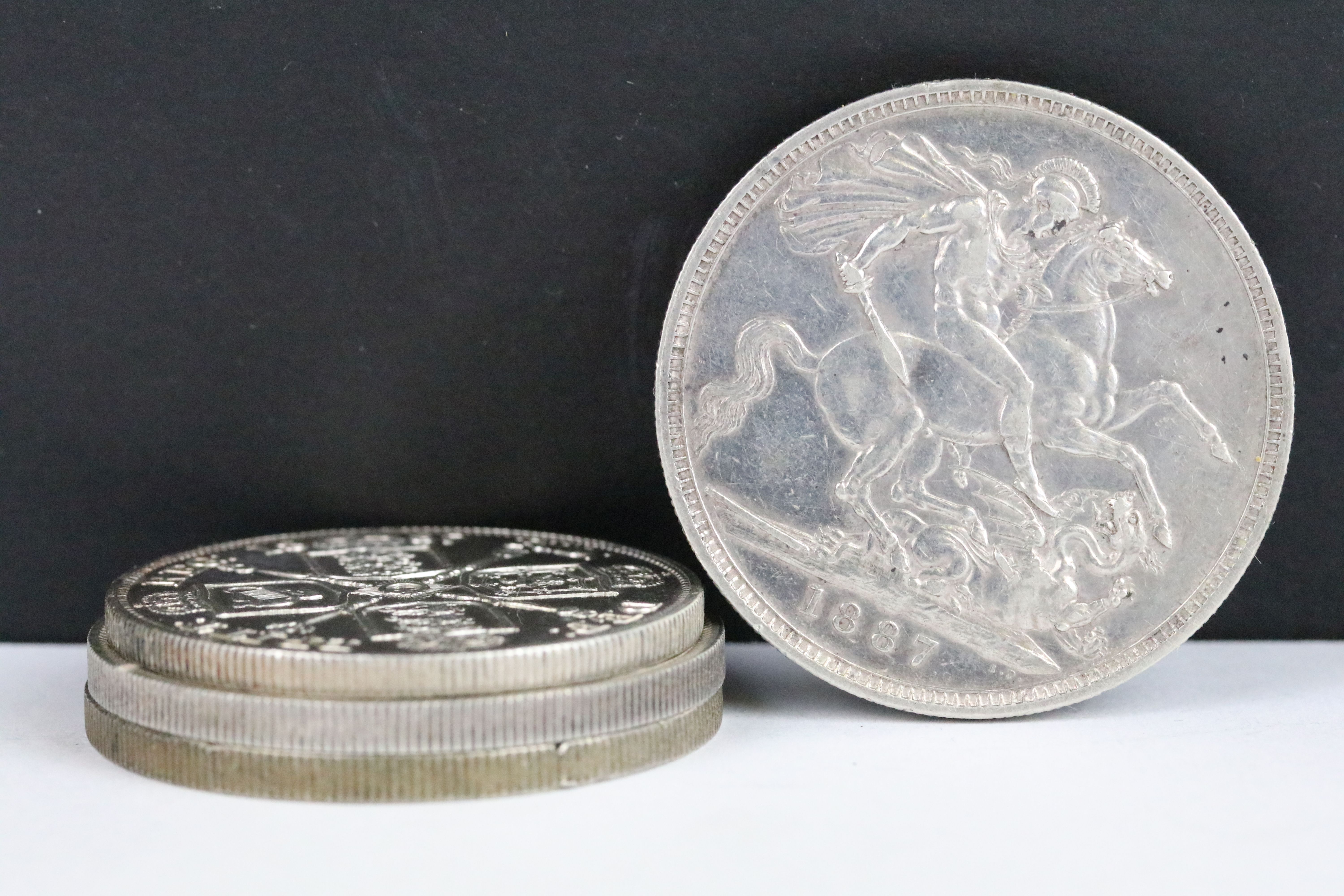 A collection of three British Queen Victoria silver Crown coins to include 1890, 1887 and 1887