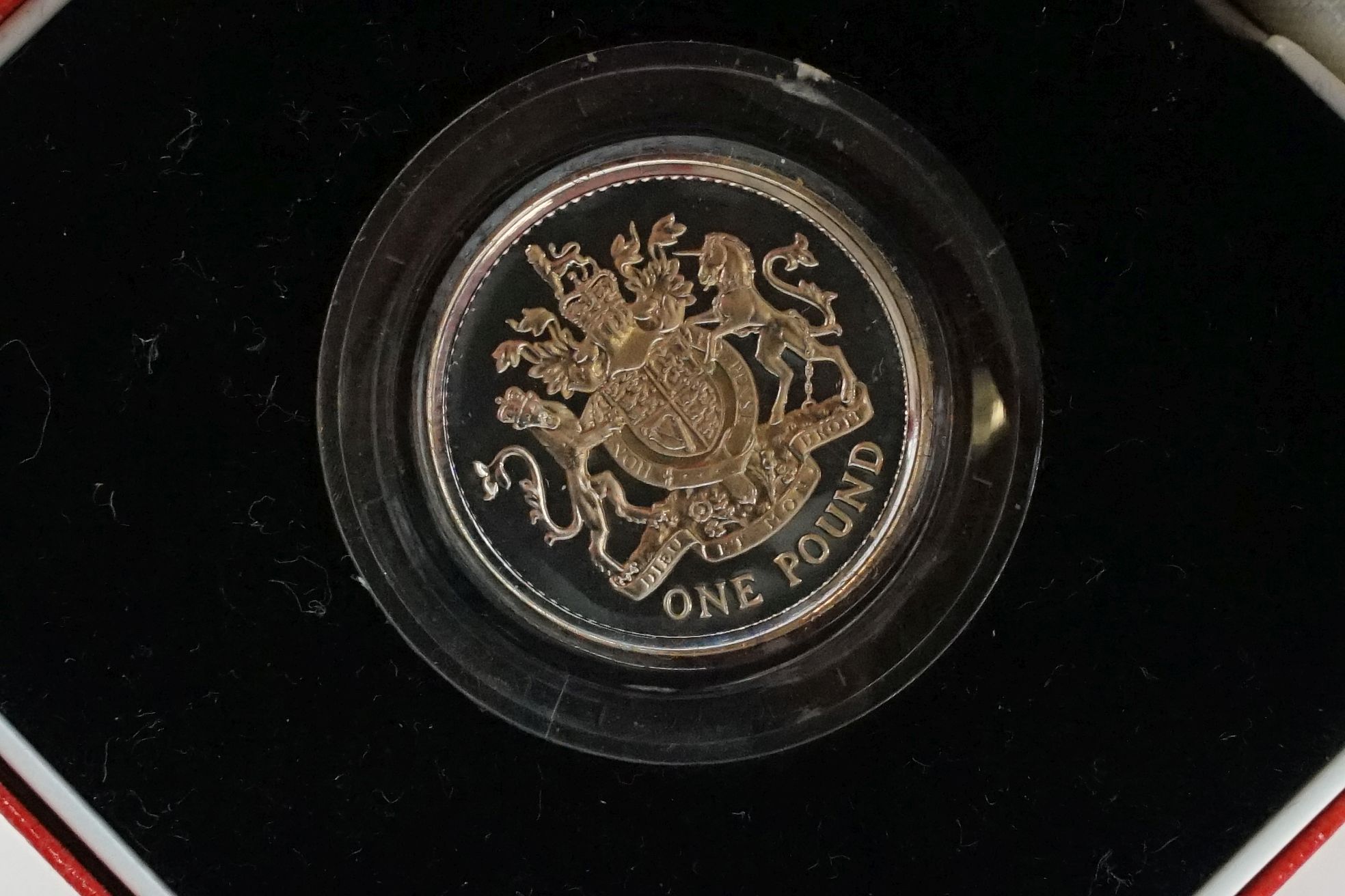 A collection of four Royal Mint silver proof £1 coins to include 2002, 1985, 1983 and 1988 examples, - Image 3 of 13