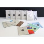 A collection of ten Royal Mint uncirculated collectors 50p coin packs to include The Snowman, 50