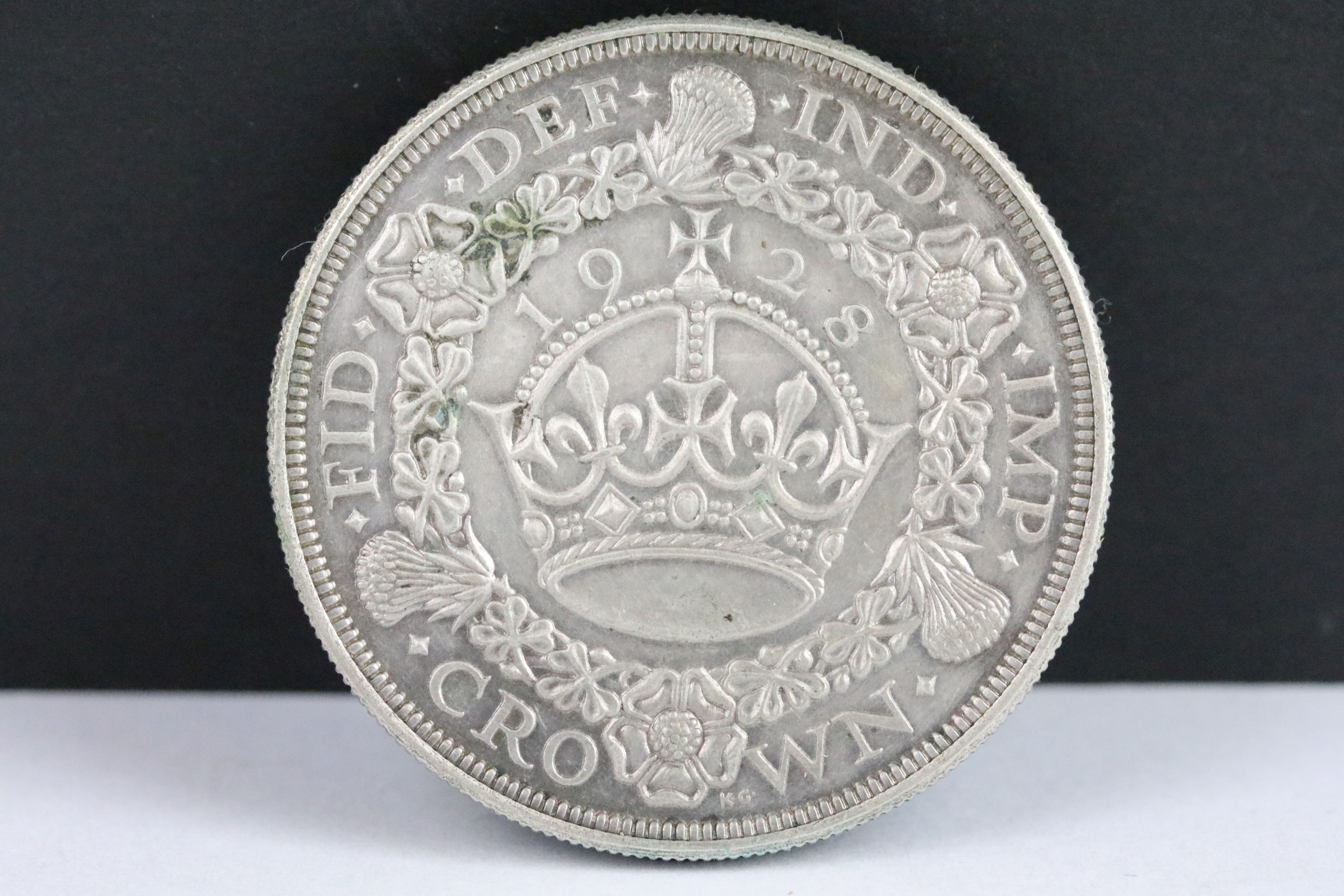 A British King George V 1928 silver Wreath Crown coin.