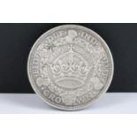 A British King George V 1928 silver Wreath Crown coin.