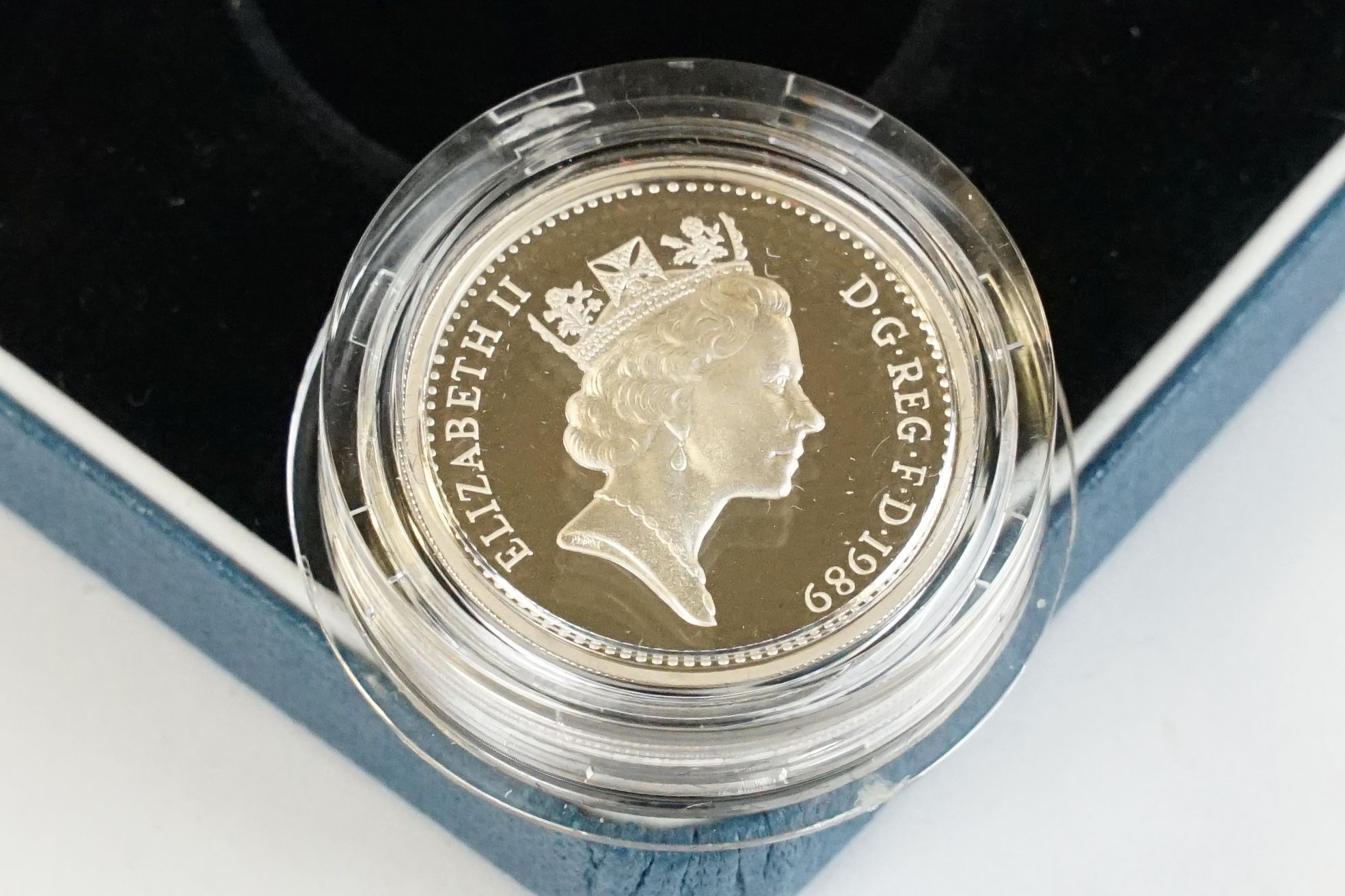 A collection of four Royal Mint silver proof £1 coins to include 2002, 2003, 1989 and 1984 examples, - Image 10 of 13