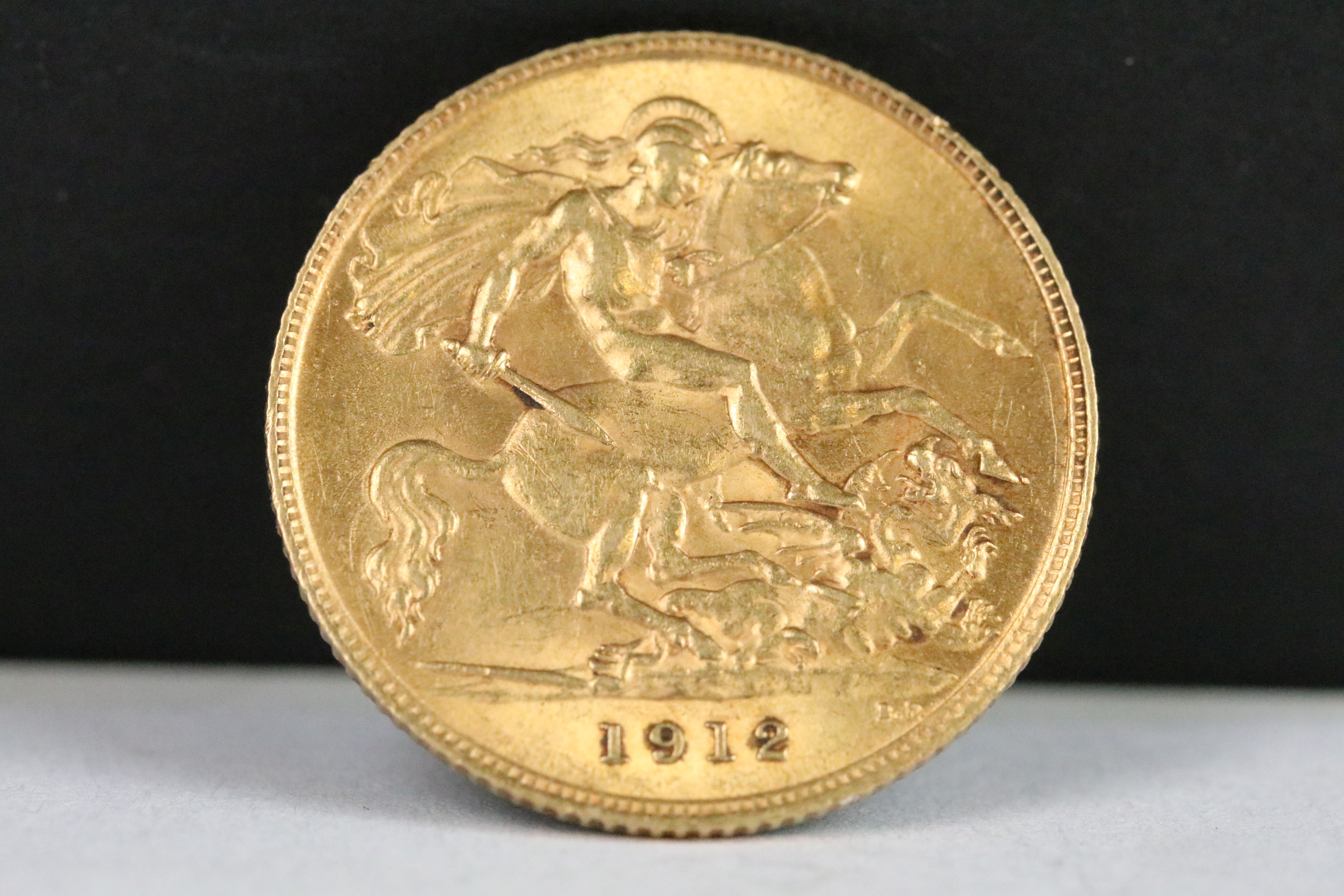 A British King George V 1912 gold half sovereign coin.