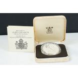 A Royal Mint silver proof Queen Mother 80th Birthday crown coin encapsulated within fitted display