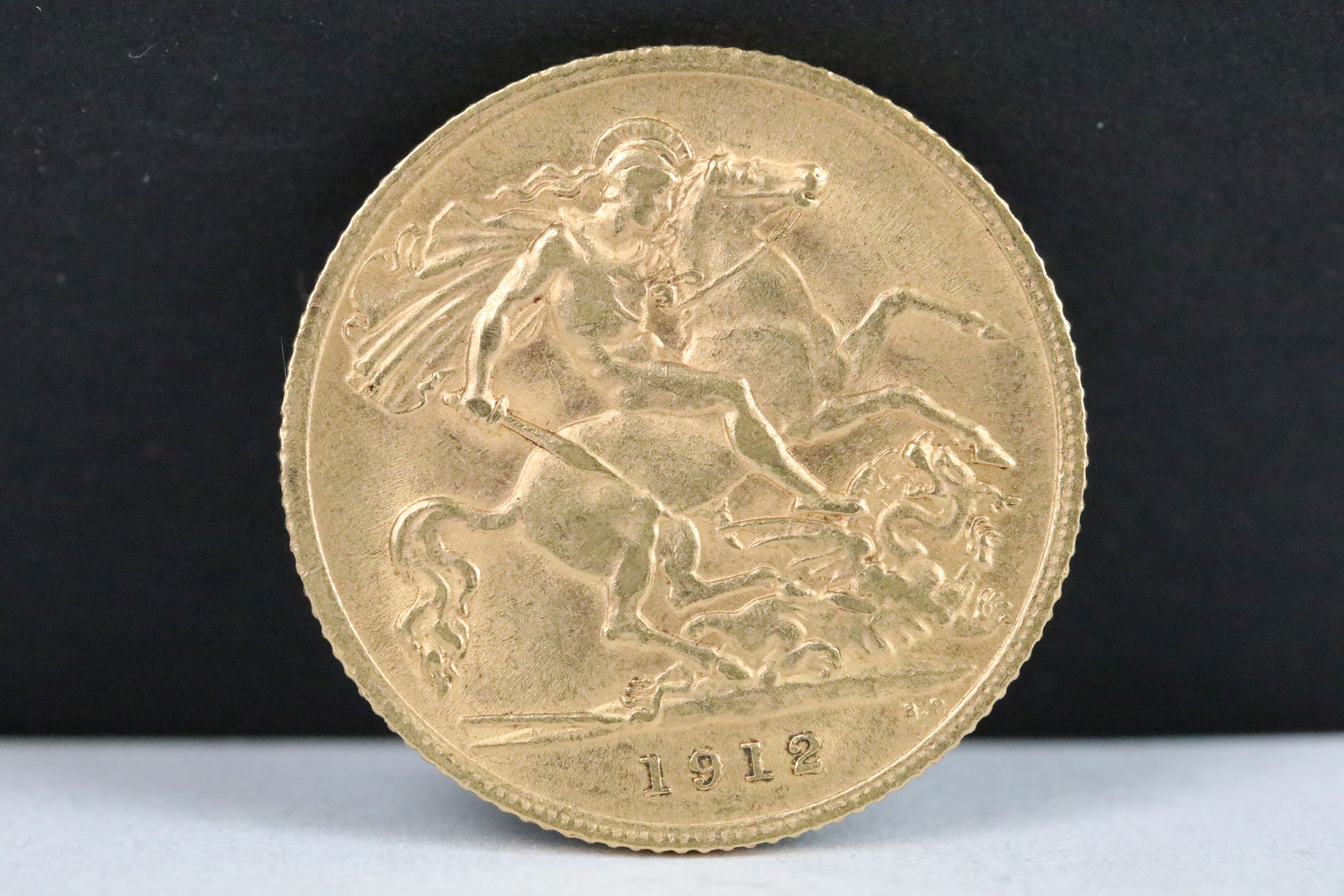 A British King George V 1912 gold half sovereign coin.