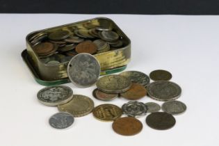 A small collection of British pre decimal and world coins to include four silver crown coins.