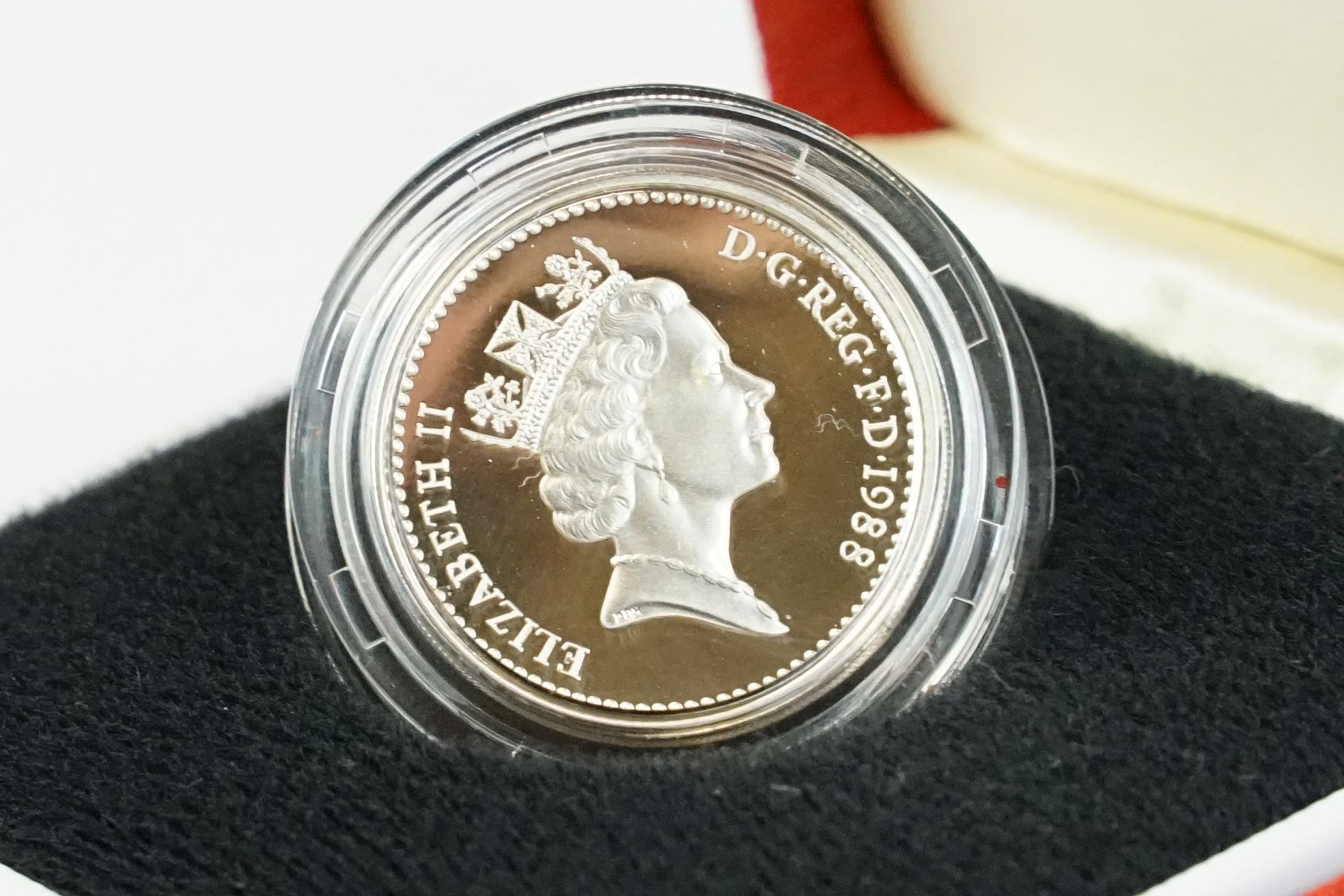 A collection of four Royal Mint silver proof £1 coins to include 2002, 1985, 1983 and 1988 examples, - Image 10 of 13